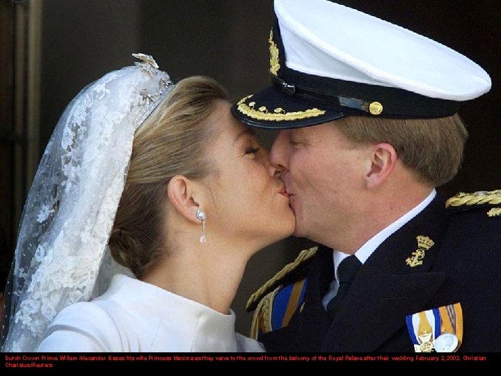 Dutch Crown Prince Willem-Alexander kisses his wife Princess Maxima as they wave to the