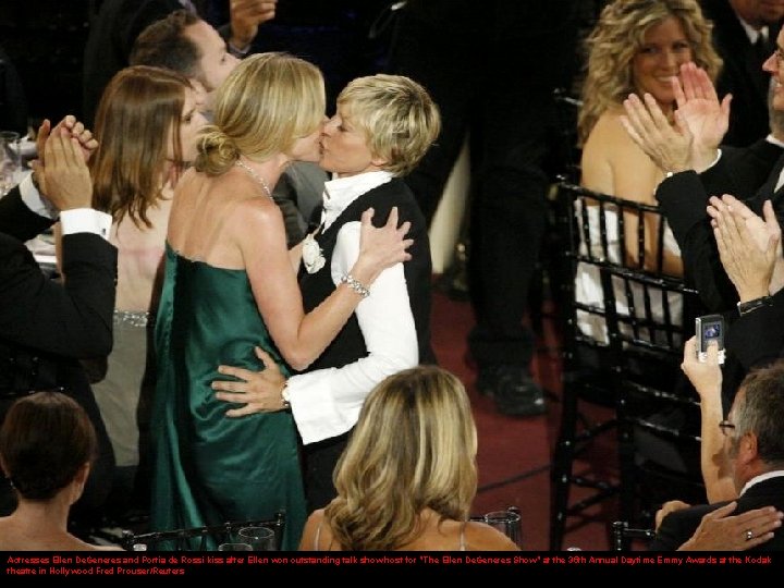 Actresses Ellen De. Generes and Portia de Rossi kiss after Ellen won outstanding talk