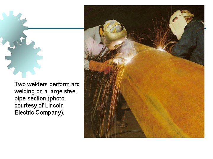 Two welders perform arc welding on a large steel pipe section (photo courtesy of