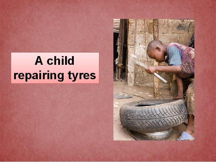A child repairing tyres 