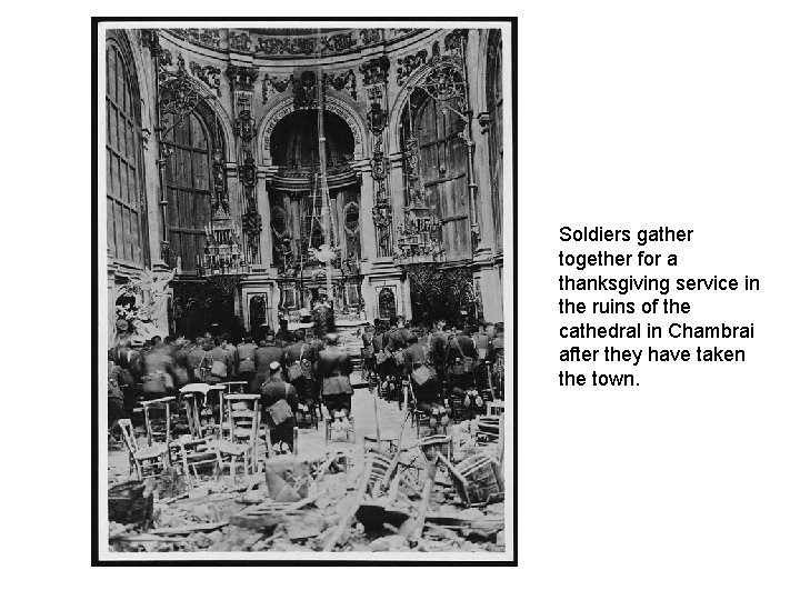 Soldiers gather together for a thanksgiving service in the ruins of the cathedral in