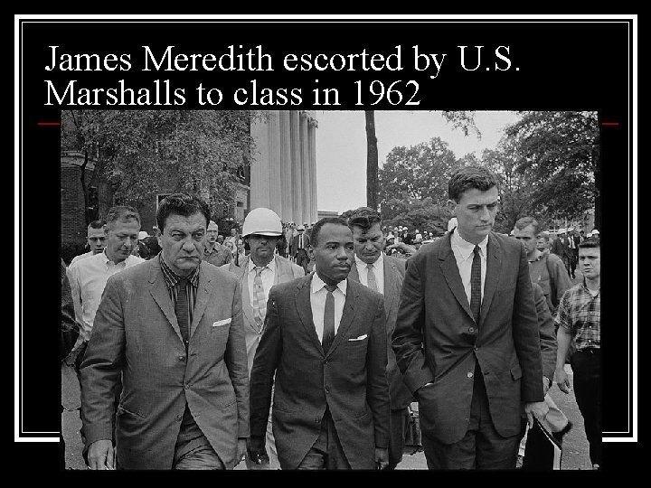 James Meredith escorted by U. S. Marshalls to class in 1962 