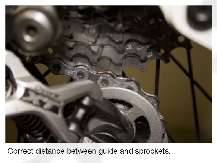 Correct distance between guide and sprockets. 