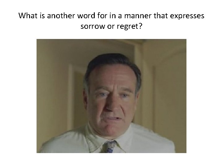 What is another word for in a manner that expresses sorrow or regret? 