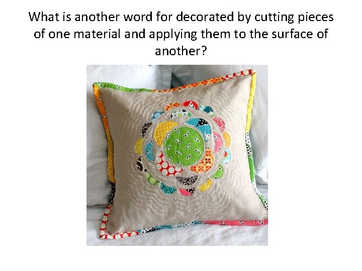 What is another word for decorated by cutting pieces of one material and applying