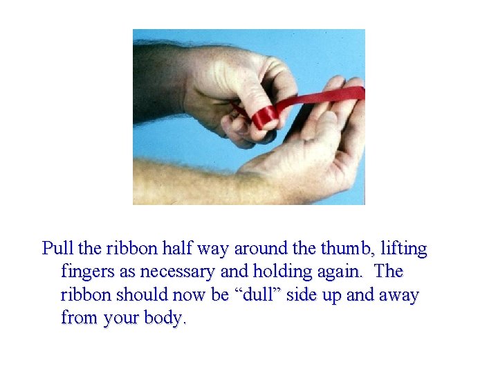 Pull the ribbon half way around the thumb, lifting fingers as necessary and holding