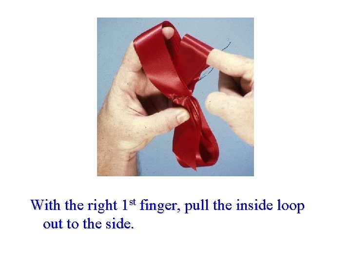 With the right 1 st finger, pull the inside loop out to the side.