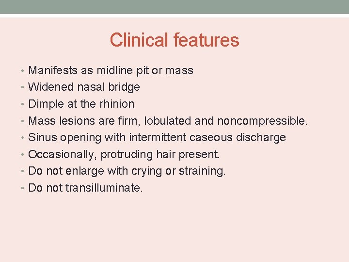 Clinical features • Manifests as midline pit or mass • Widened nasal bridge •