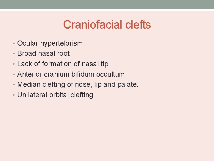 Craniofacial clefts • Ocular hypertelorism • Broad nasal root • Lack of formation of