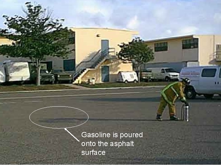 Gasoline is poured onto the asphalt surface 
