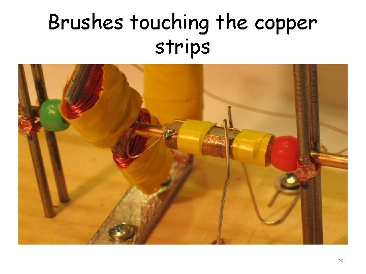 Brushes touching the copper strips 24 