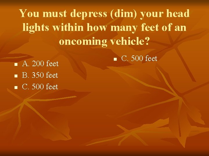 You must depress (dim) your head lights within how many feet of an oncoming