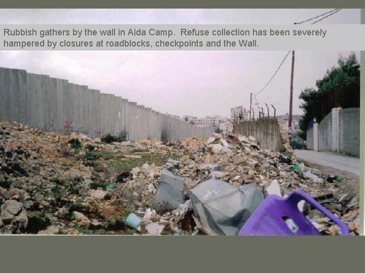 Rubbish gathers by the wall in Aida Camp. Refuse collection has been severely hampered