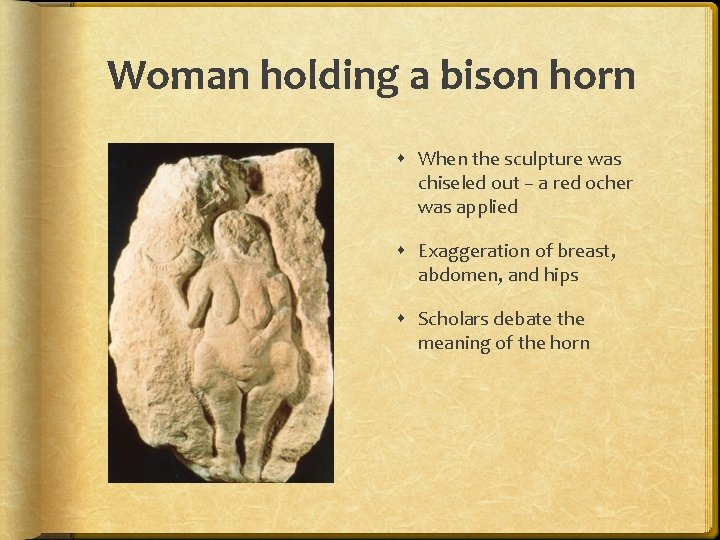 Woman holding a bison horn When the sculpture was chiseled out – a red