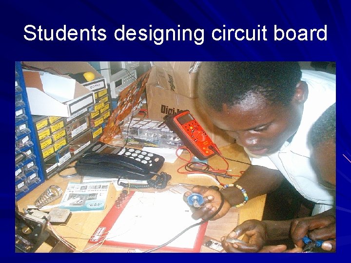 Students designing circuit board 