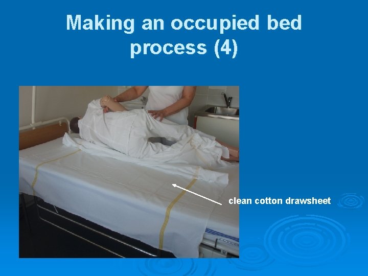 Making an occupied bed process (4) clean cotton drawsheet 
