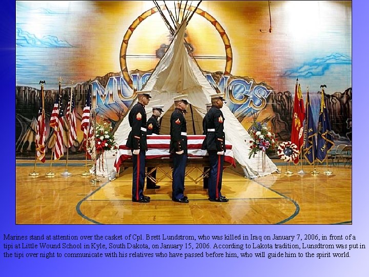 Marines stand at attention over the casket of Cpl. Brett Lundstrom, who was killed