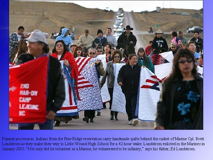 Funeral procession: Indians from the Pine Ridge reservation carry handmade quilts behind the casket