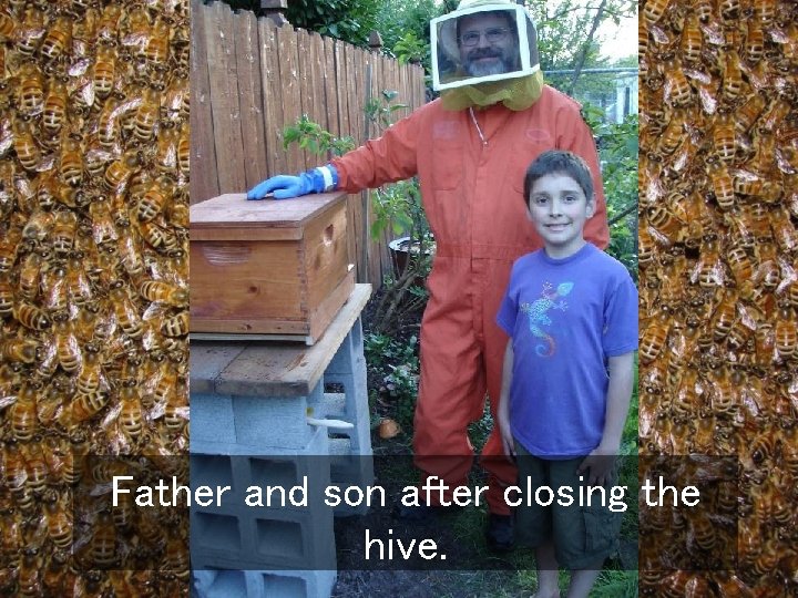 Father and son after closing the hive. 