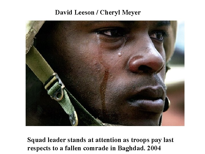 David Leeson / Cheryl Meyer Squad leader stands at attention as troops pay last