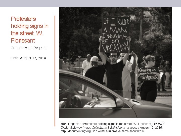 Protesters holding signs in the street. W. Florissant Creator: Mark Regester Date: August 17,