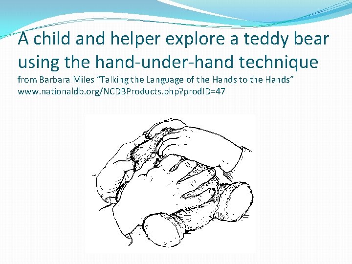 A child and helper explore a teddy bear using the hand-under-hand technique from Barbara
