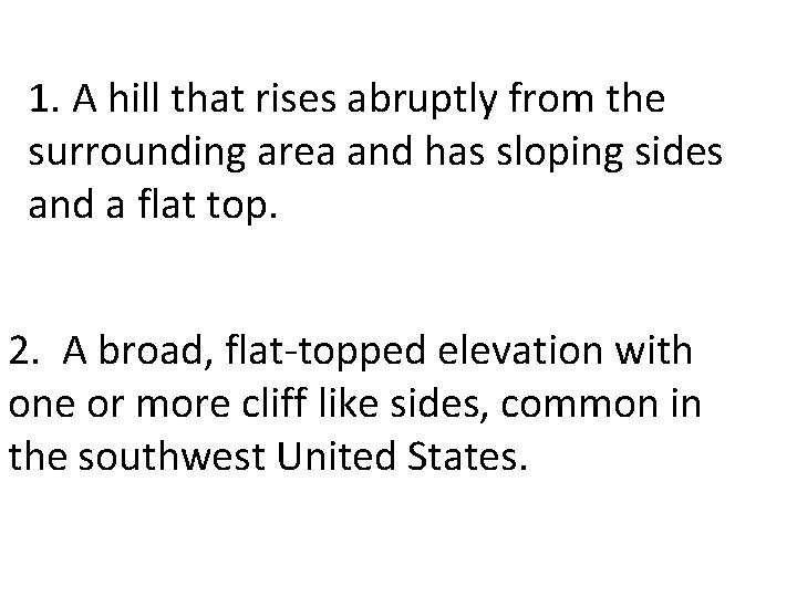1. A hill that rises abruptly from the surrounding area and has sloping sides