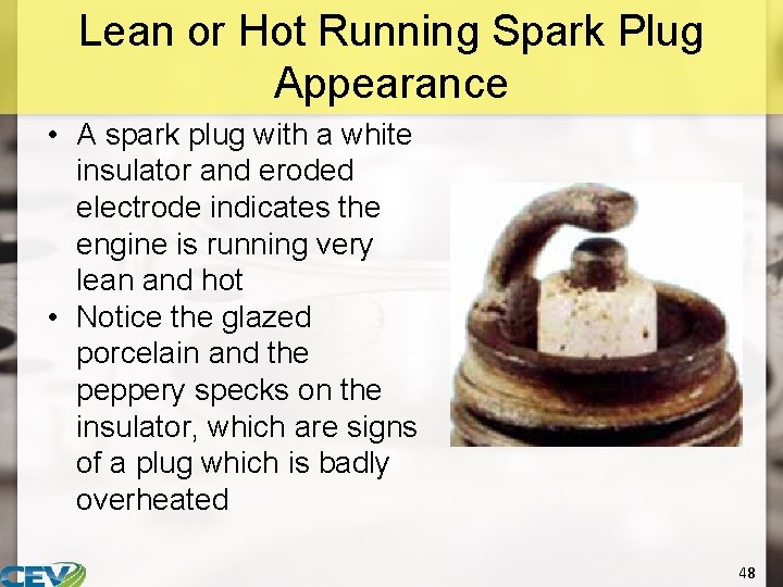 Lean or Hot Running Spark Plug Appearance • A spark plug with a white