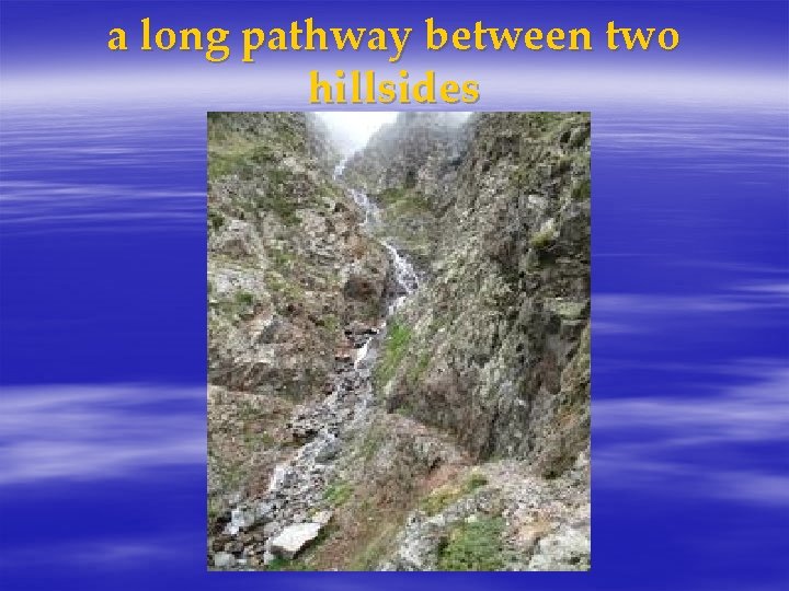 a long pathway between two hillsides 