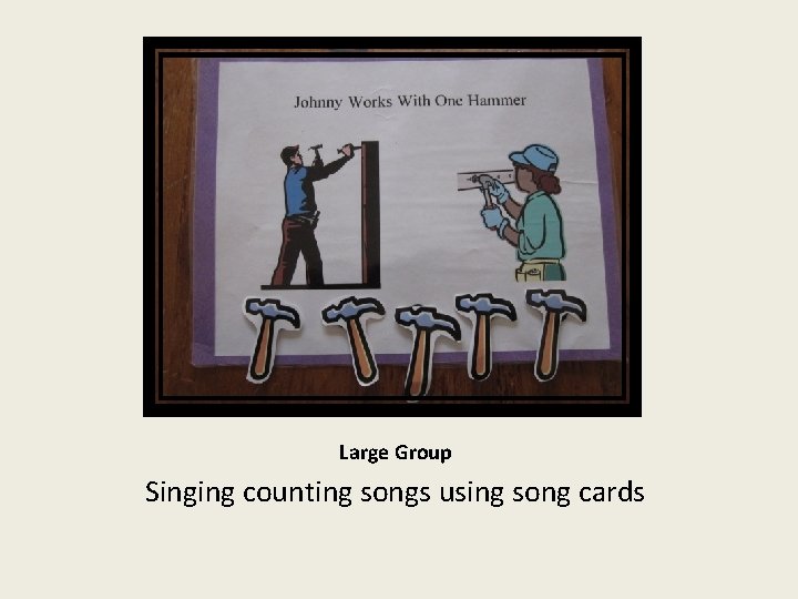 Large Group Singing counting songs using song cards 