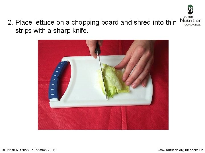 2. Place lettuce on a chopping board and shred into thin strips with a