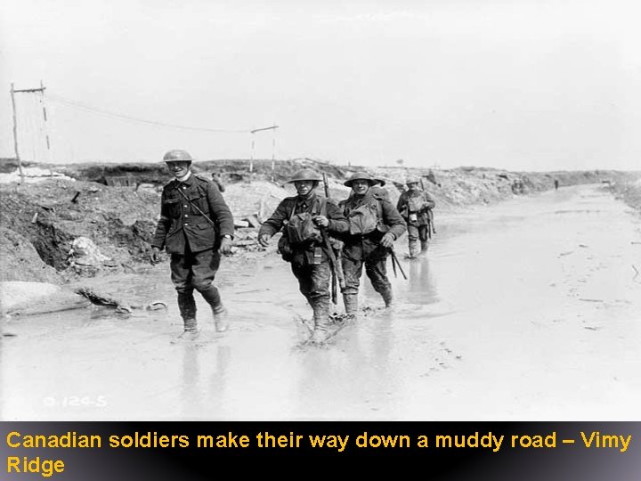 Canadian soldiers make their way down a muddy road – Vimy Ridge 