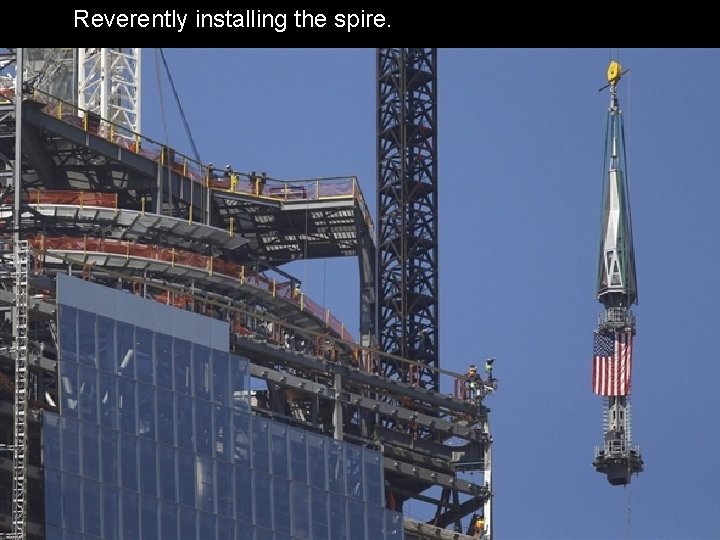 Reverently installing the spire. 