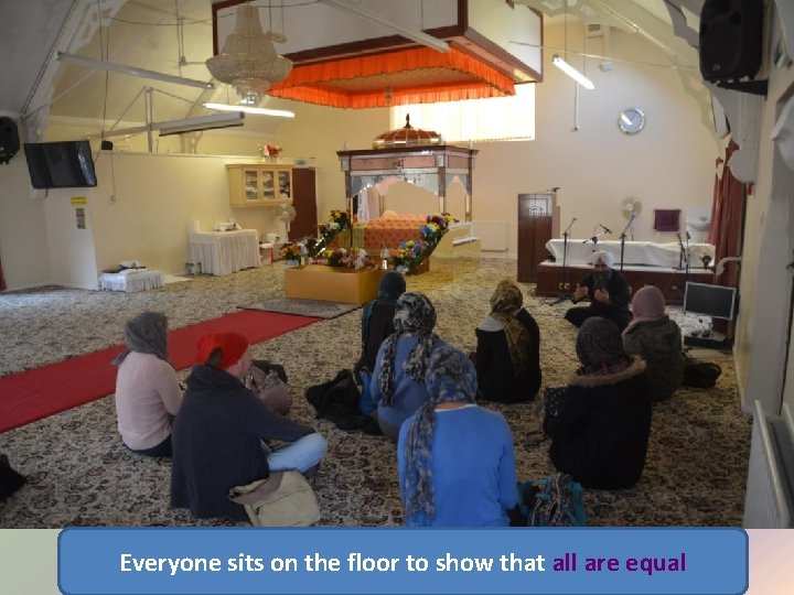 Everyone sits on the floor to show that all are equal 