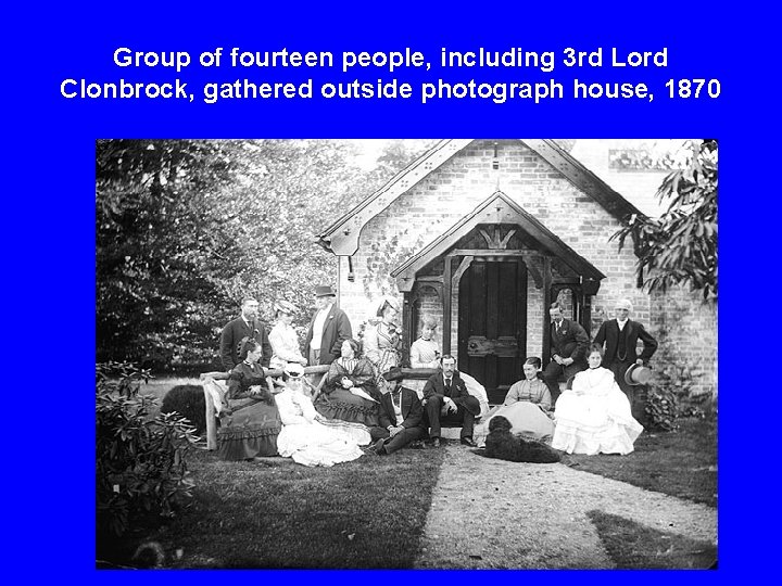 Group of fourteen people, including 3 rd Lord Clonbrock, gathered outside photograph house, 1870