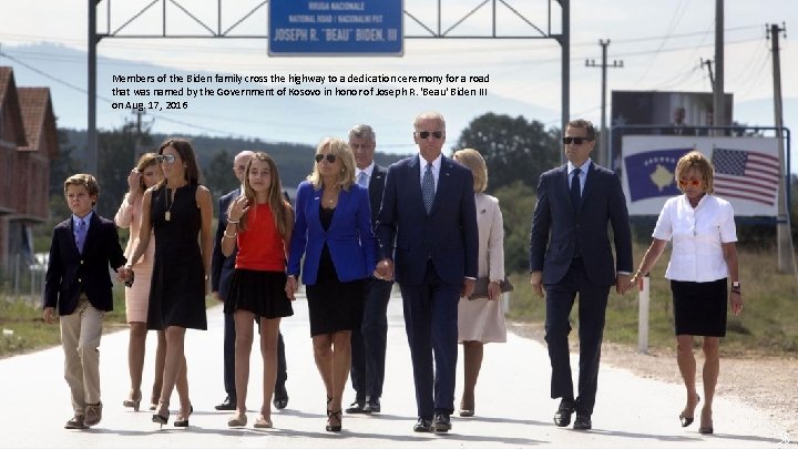 Members of the Biden family cross the highway to a dedication ceremony for a