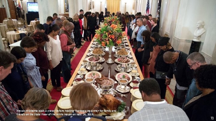 President Obama leads a prayer before hosting Thanksgiving dinner for family and friends on