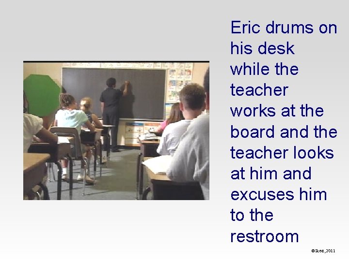 Eric drums on his desk while the teacher works at the board and the