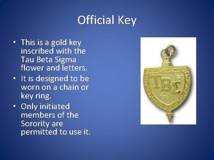 Official Key • This is a gold key inscribed with the Tau Beta Sigma