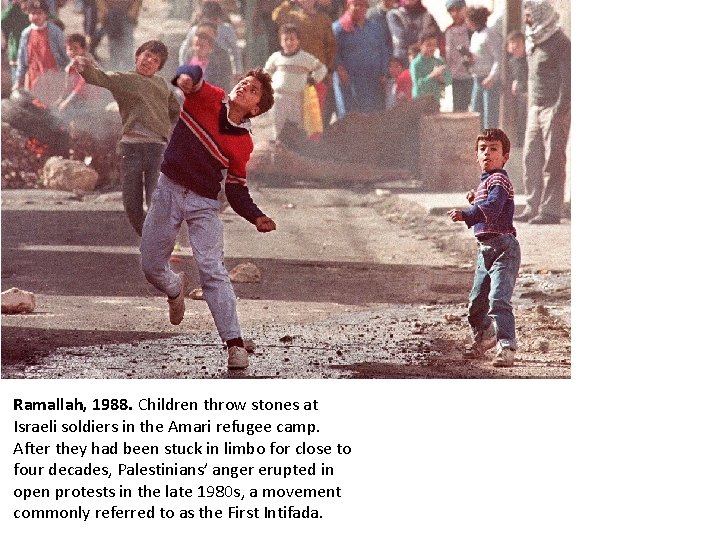 Ramallah, 1988. Children throw stones at Israeli soldiers in the Amari refugee camp. After