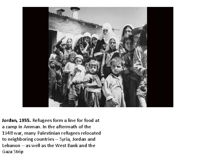 Jordan, 1955. Refugees form a line for food at a camp in Amman. In