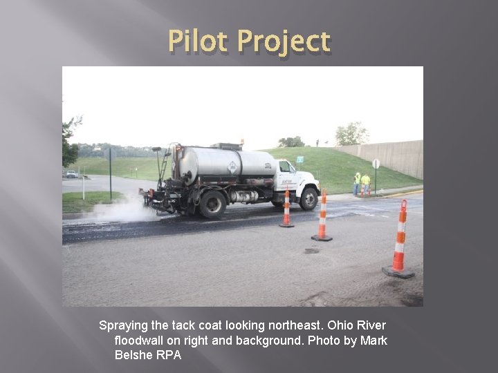 Pilot Project Spraying the tack coat looking northeast. Ohio River floodwall on right and