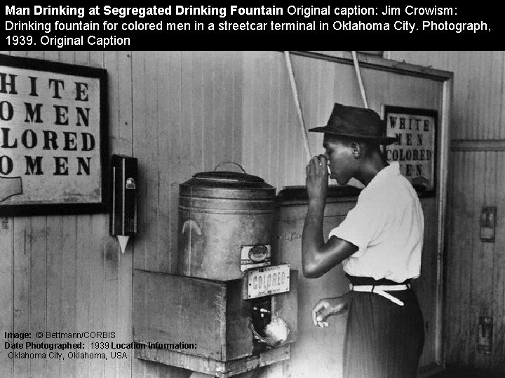 Man Drinking at Segregated Drinking Fountain Original caption: Jim Crowism: Drinking fountain for colored