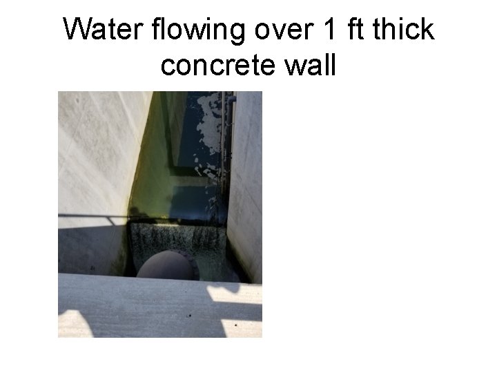Water flowing over 1 ft thick concrete wall Water flowing over 1 ft thick concrete wall