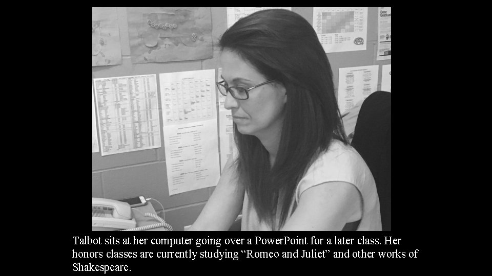 Talbot sits at her computer going over a Power. Point for a later class.