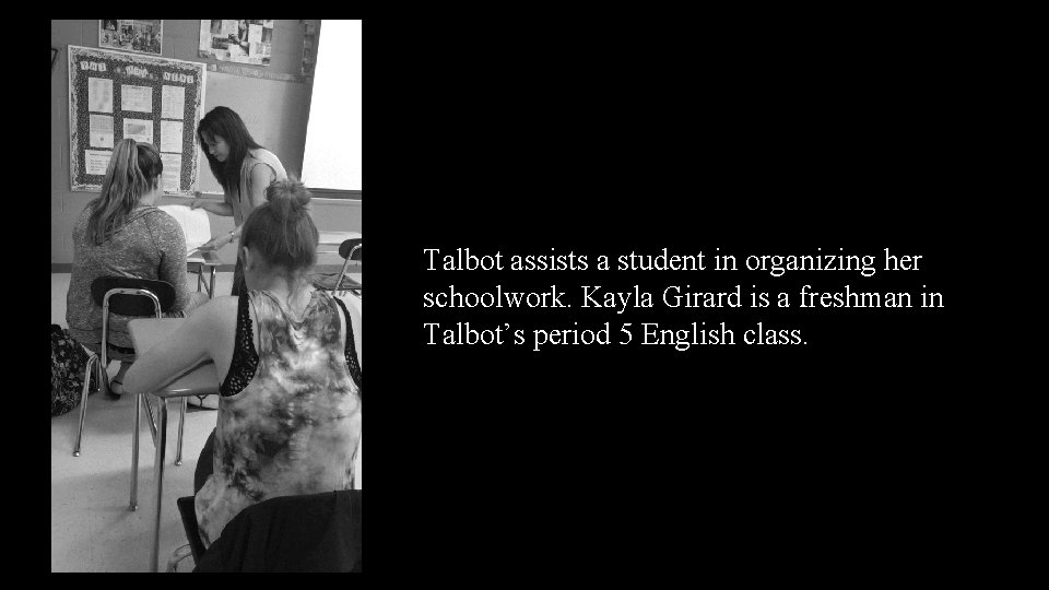 Talbot assists a student in organizing her schoolwork. Kayla Girard is a freshman in