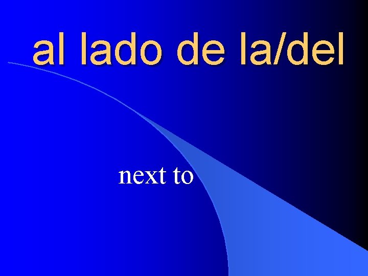 al lado de la/del next to 