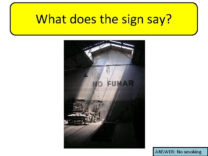 What does the sign say? ANSWER: No smoking 