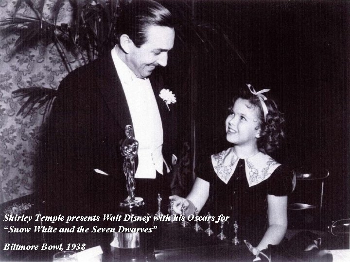 Shirley Temple presents Walt Disney with his Oscars for “Snow White and the Seven
