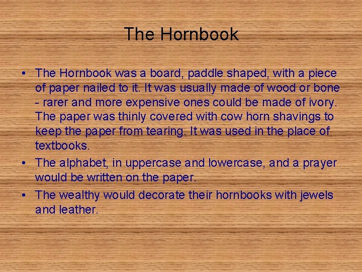 The Hornbook • The Hornbook was a board, paddle shaped, with a piece of